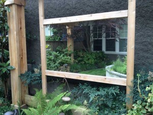 using mirrors in landscape design, using mirrors to make gardens seem bigger